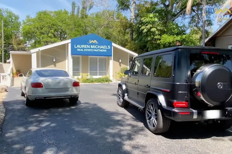 Exterior of client’s office building with parked cars in front